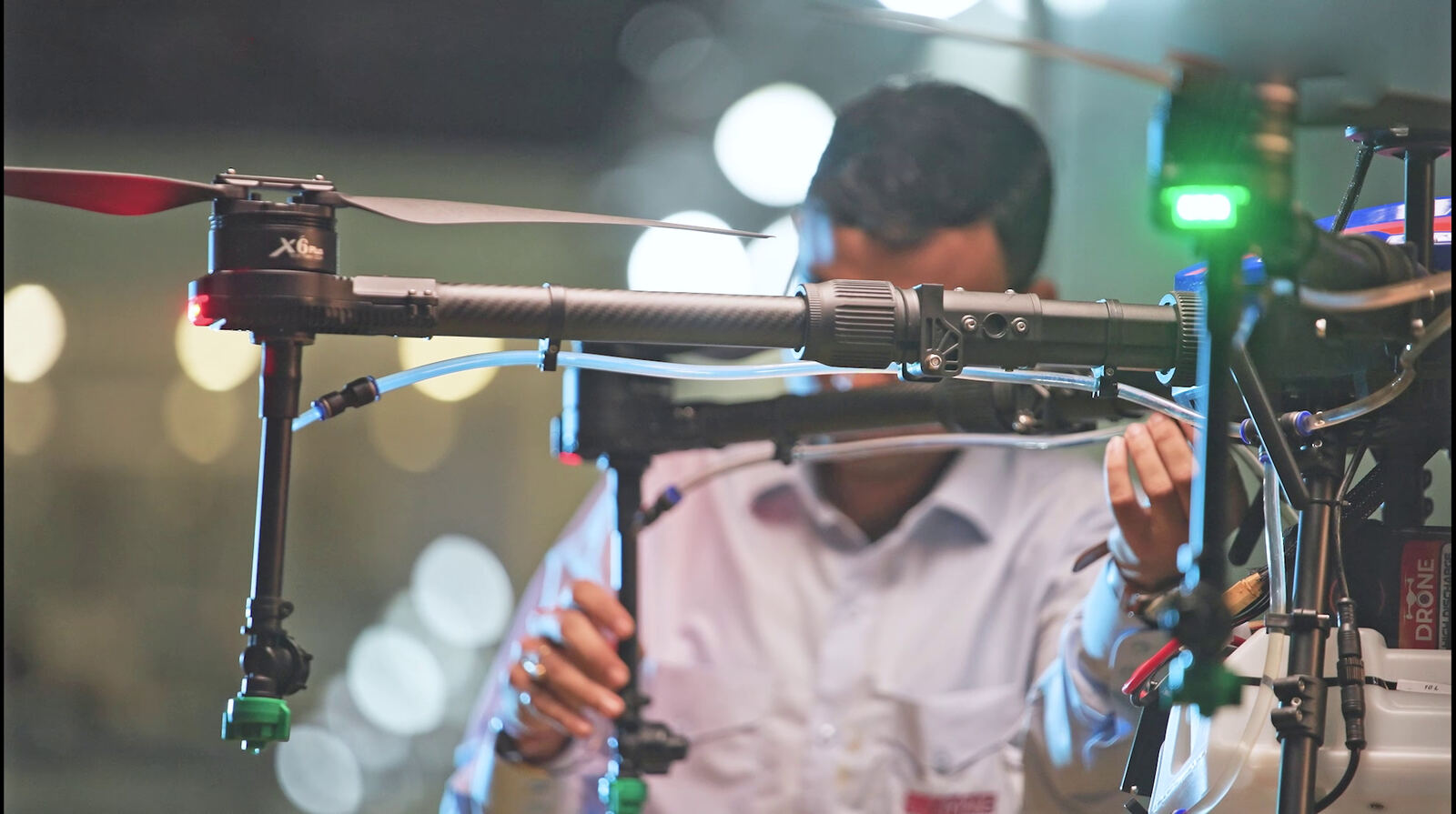 A technician servicing the drone